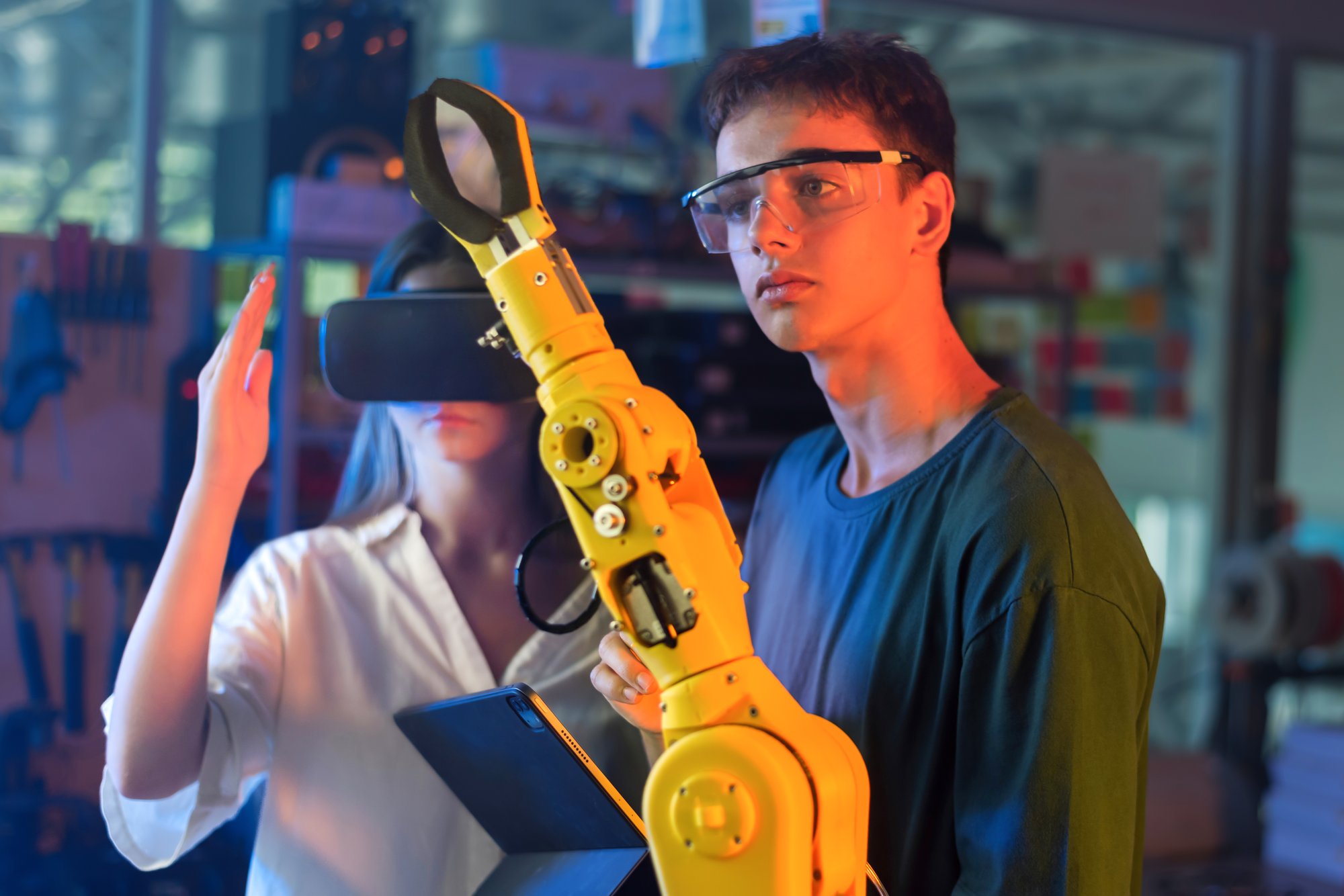 teens-doing-experiments-robotics-laboratory-boy-protective-glasses-looking-robot